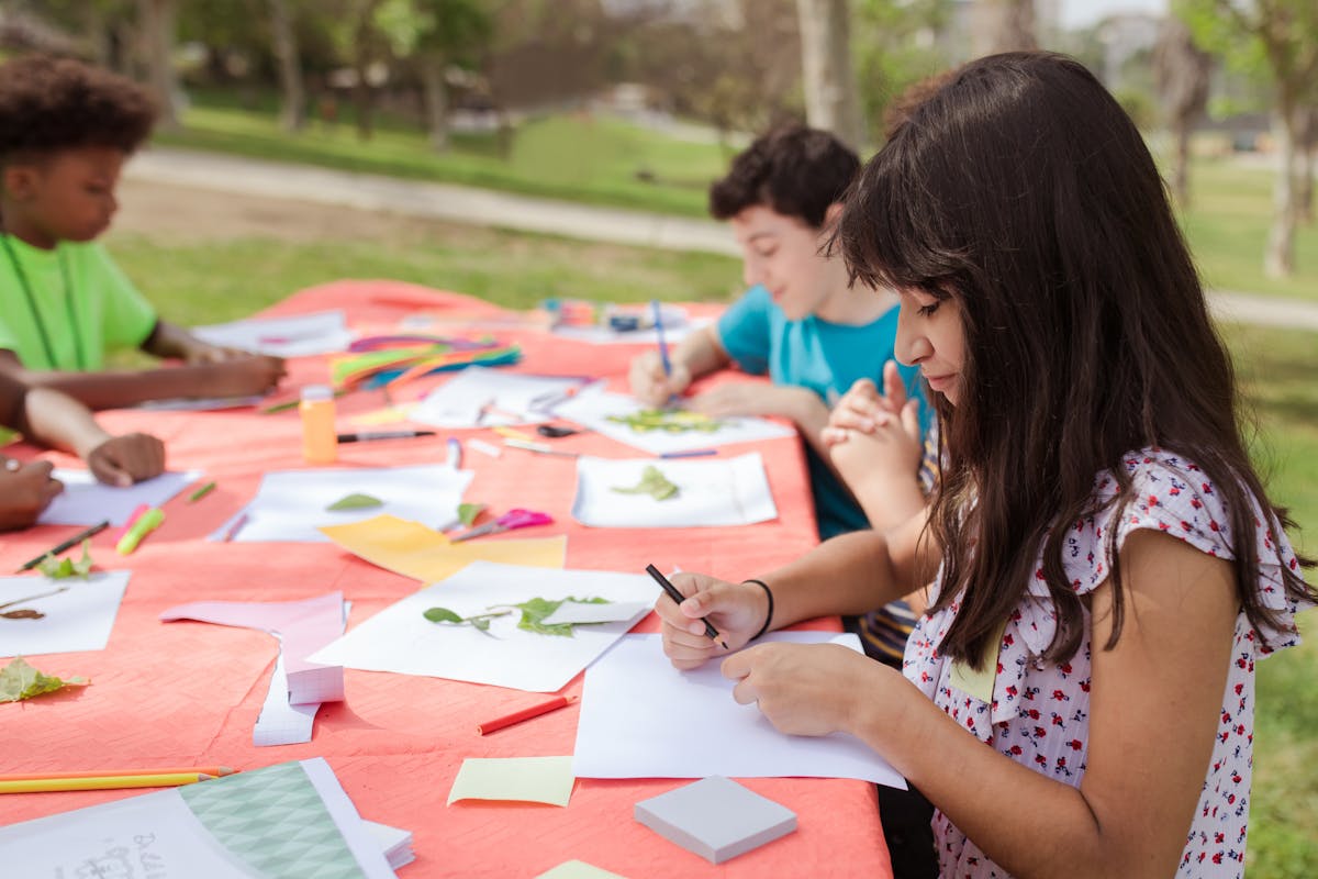 Children doing creative outdoor learning activities
